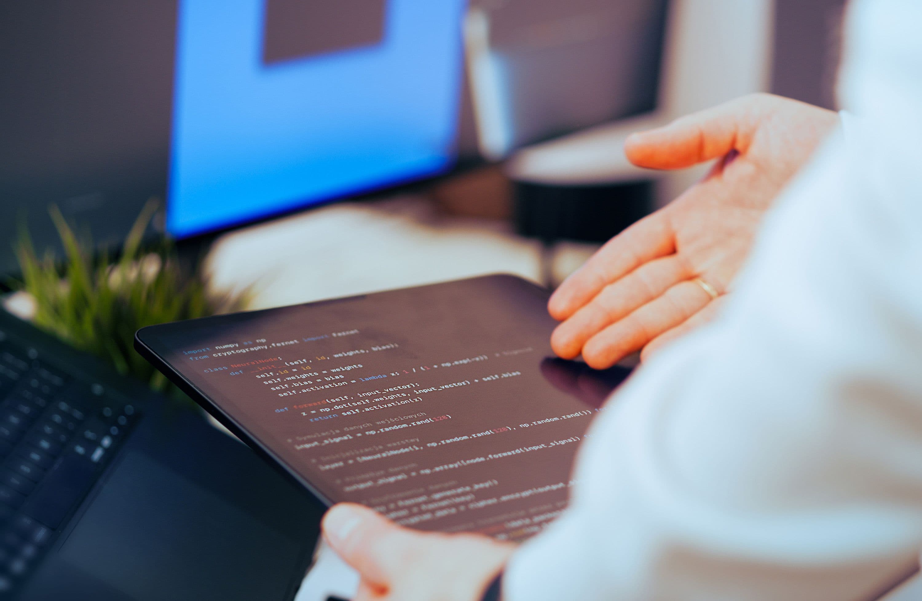 Developer building AI-integrated web applications on dual monitors