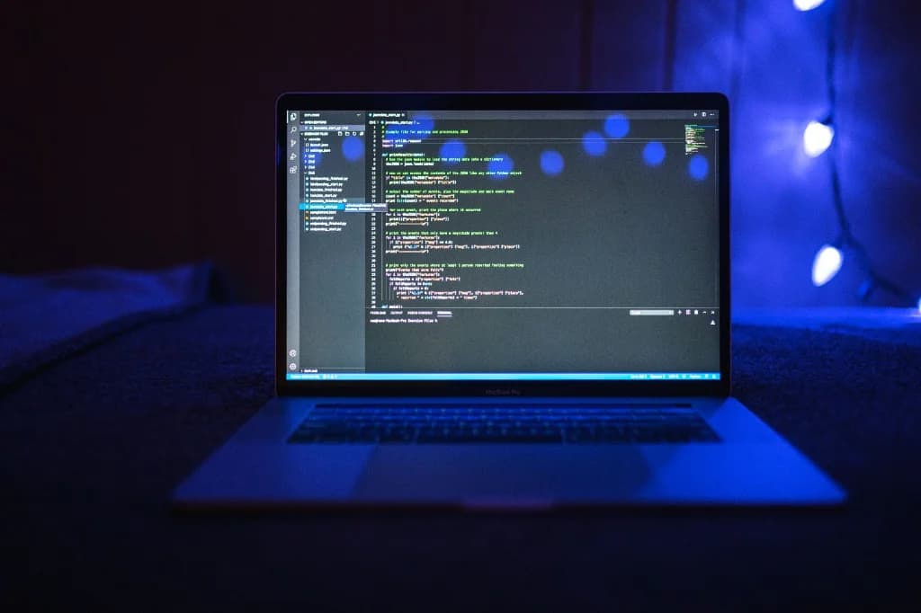 Developer scoping an AI-powered web application on a laptop