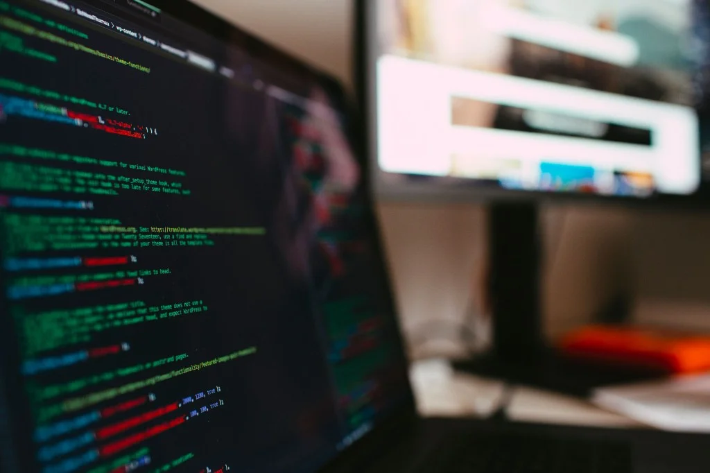 Developer coding an AI MVP on a laptop